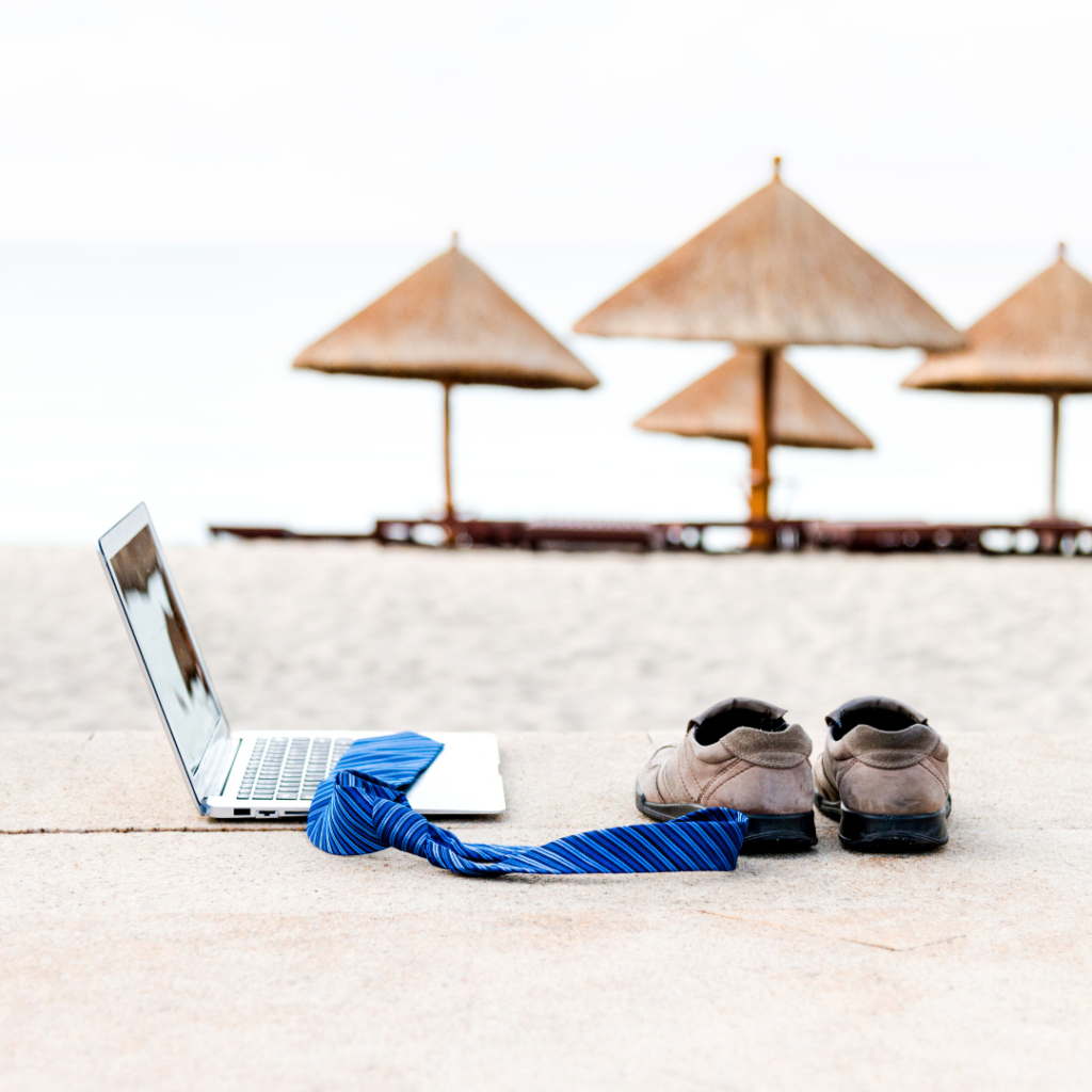 Business Travels laptop Work on the beach with nipa hut