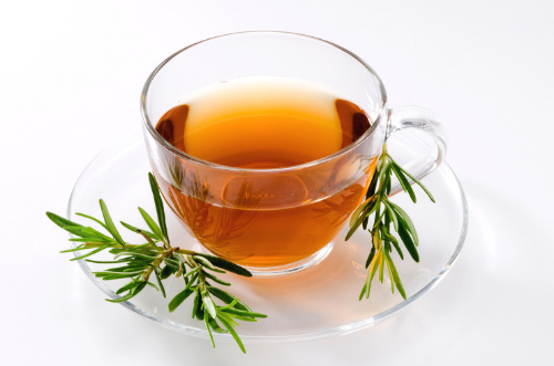 Rosemary Tea with ht water in a clear tea cup