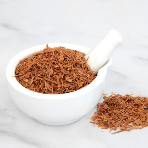 Cats Claw Herb in a bowl and table