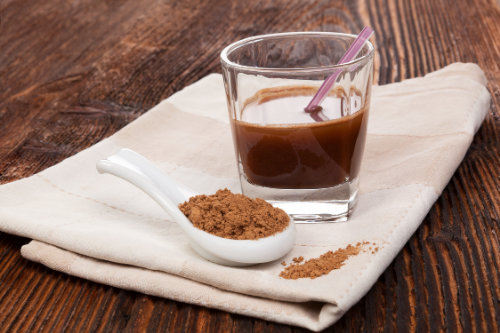Reishi with Cacao Coffee Alternative in a Glass and spoon 
